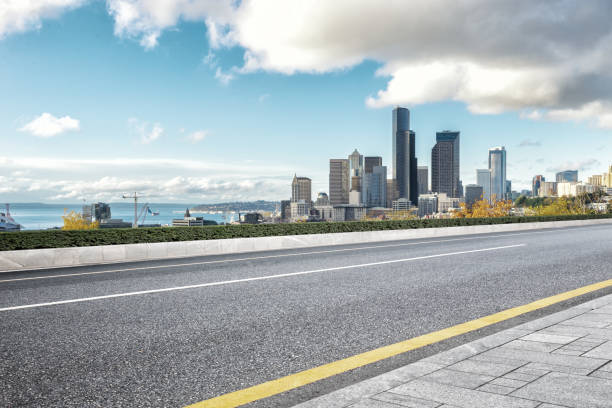 istock empty road with cityscape of modern city 835750110