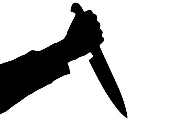 Isolated human hand with killing kitchen knife silhouette (shadow) on white background. Graphic resources for designers and criminal news and chronicles.