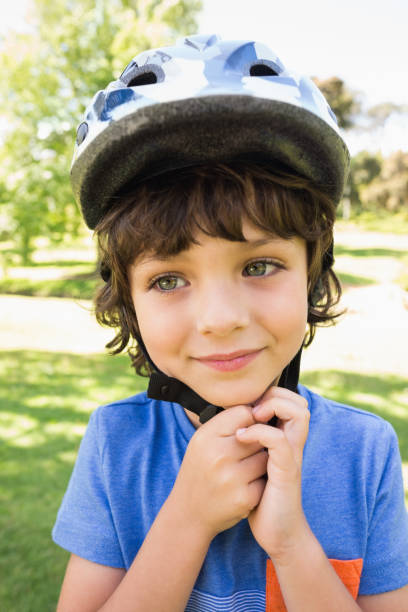 istock Cute little boy wearing bicycle helmet 835754432