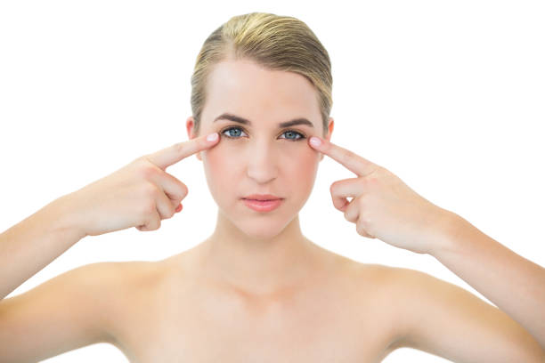 istock Pretty blonde pointing at her crows feet 835755218