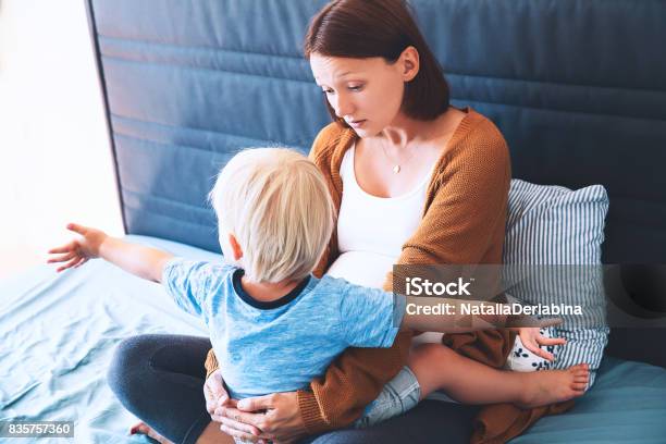 Pregnant Mother And Son At Home Pregnant For Second Time With First Child Stock Photo - Download Image Now