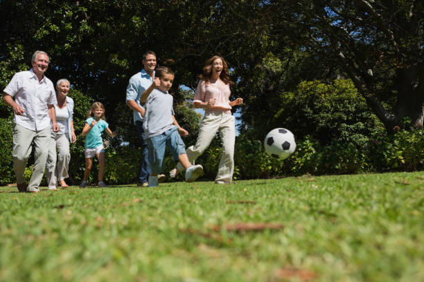 istock Cheerful multi generation family playing football 835757434