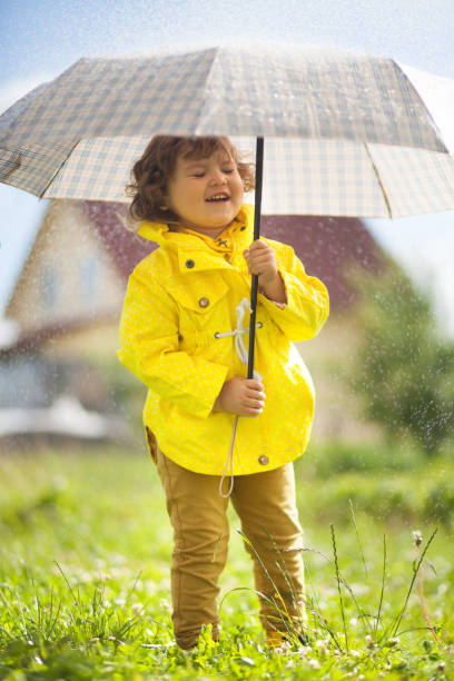 istock Having fun under the rain, emotional little girl 835764302