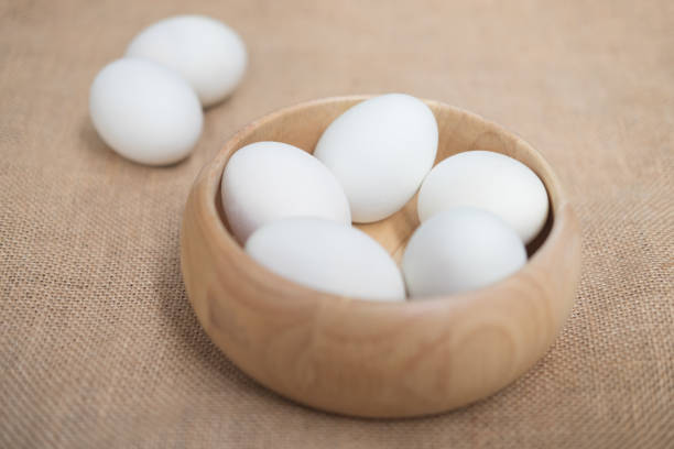 istock Duck eggs or salted egg in wooden bowl 835764328