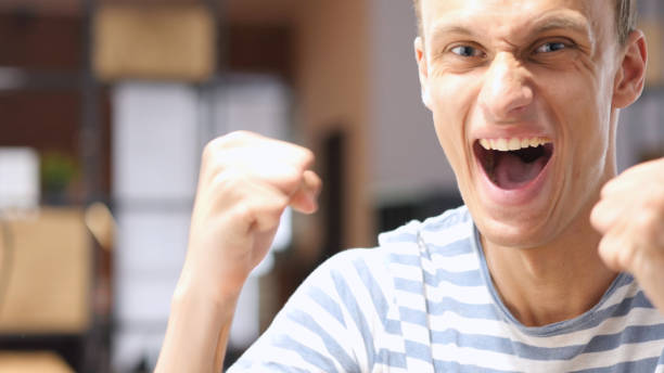 istock young successful man, businessman arms raised celebrating cheering Victory 835765880