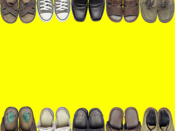 istock Many of shoes and sandal on isolate yellow background. 835769086