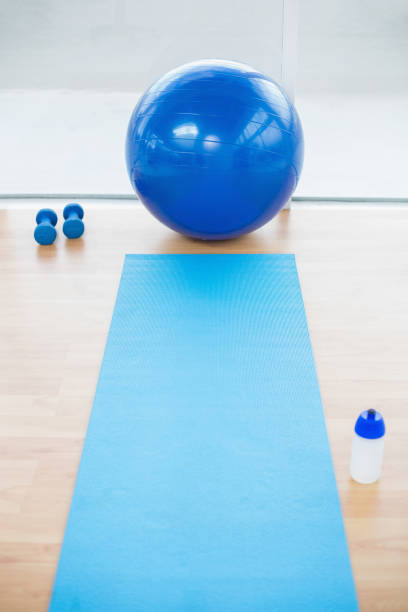 istock Empty sports hall with sport ball on background 835769392