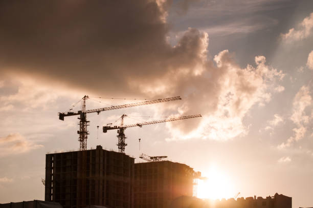 istock Construction site at sunset. tower cranes against the sky. 835772070