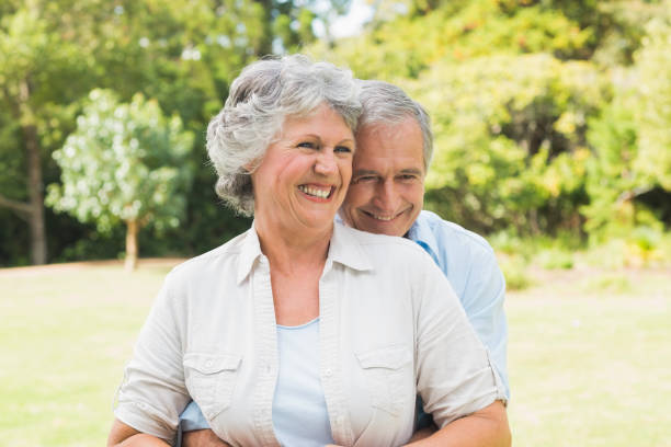 istock Happy mature couple in the park 835772424