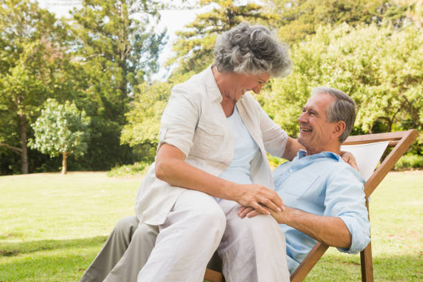 istock Smiling mature couple in park 835772650