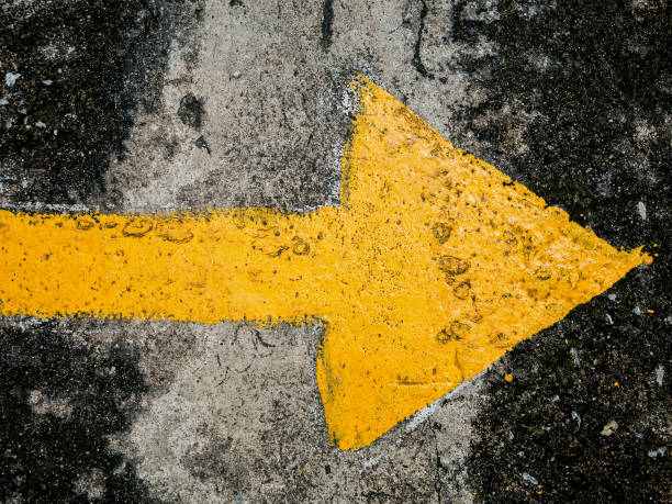 istock traffic direction arrow on the road 835776110