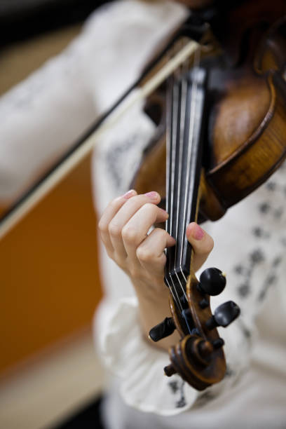istock Hand girl playing the violin 835784522