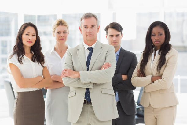 istock Business team looking at camera with arms crossed 835784636