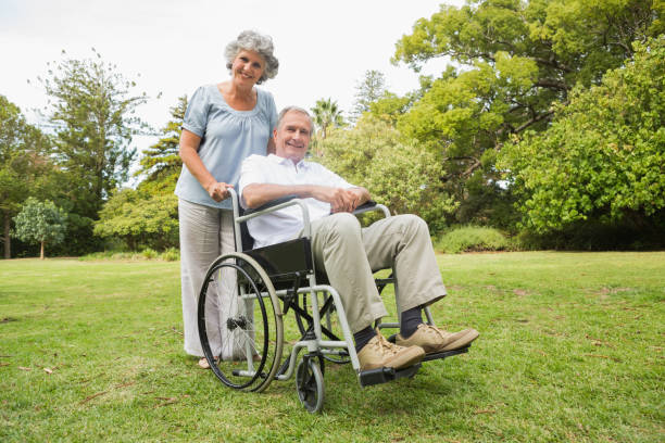 istock Happy mature man in wheelchair with partner 835791234