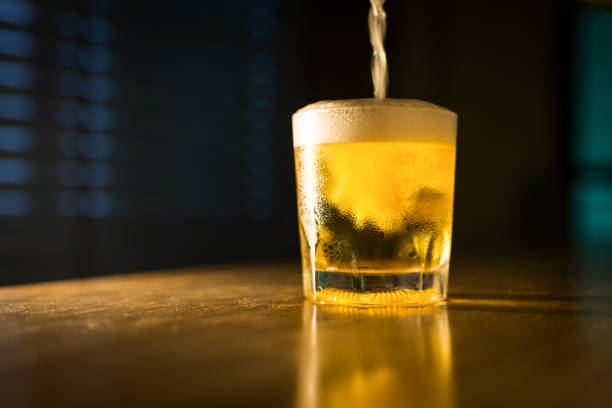 istock Beer water in glasses at pub restaurant in the evening put on the table. 835794302