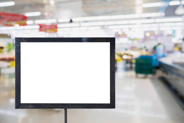 istock blank board with blur supermarket for background 835798214