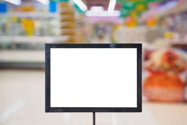 istock blank board with blur supermarket for background 835798276