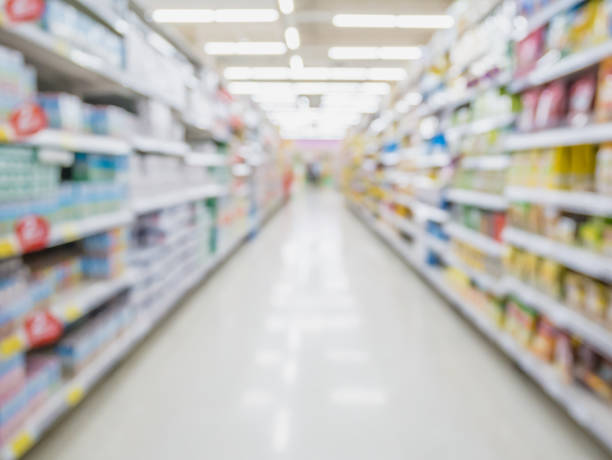istock Empty Supermarket Aisle and Shelves in blur background 835798304