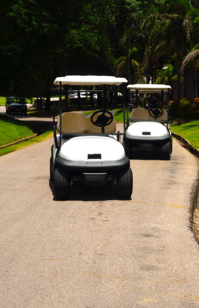 istock white golf cart in a golf course 835800864