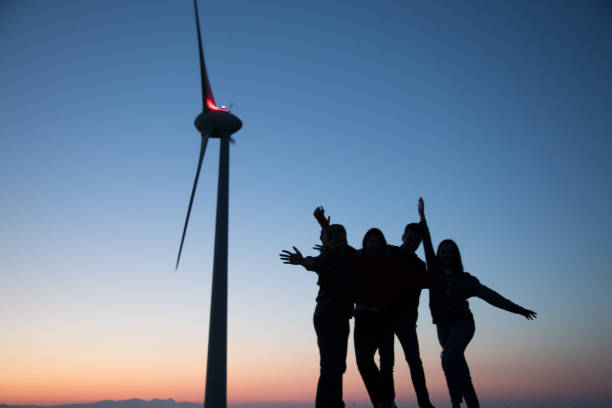 istock Group of people having fun outside at sunset time 835800956
