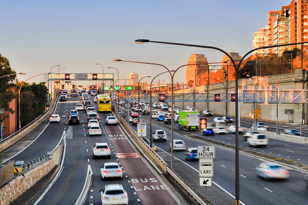 FWY Warring 2 Br Bus Lane Sydney Warringah freeway heavy rush hour traffic enterin Sydney Harbour Bridge along 24 hours bus lane in the morning. speed limit sign australia stock pictures, royalty-free photos & images