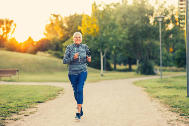 istock Senior woman jogging in the park 835807294
