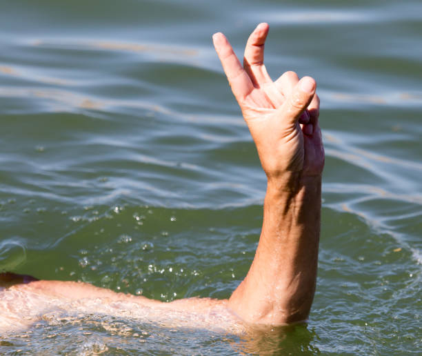 istock Man's hand on the water in the pool 835807396