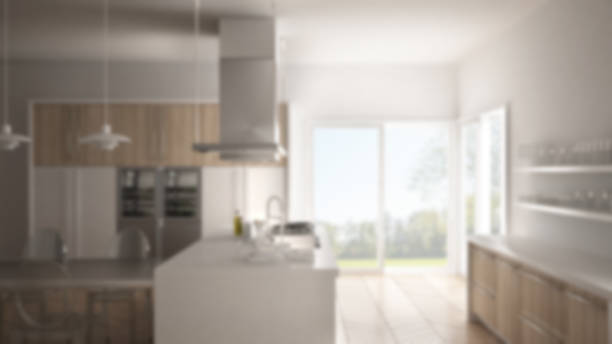istock Blur background interior design, minimalistic modern kitchen with table, chairs and parquet floor 835807532