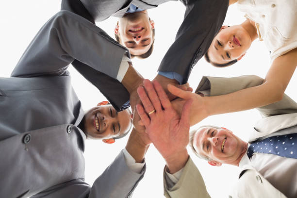 istock Business team looking down at the camera with hands together 835810232