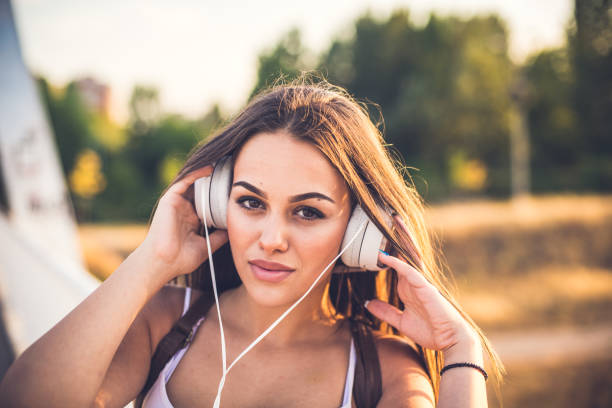 istock Attractive brunette listens to her music 835810316