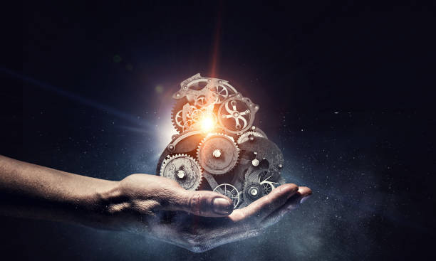 istock Cogwheel mechanism in hand. Mixed media 835810362