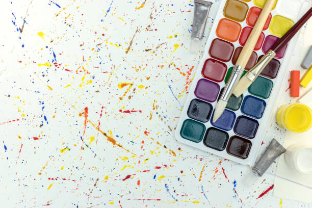 istock set of paints, pastel chalk and paintbrushes on desk 835811000