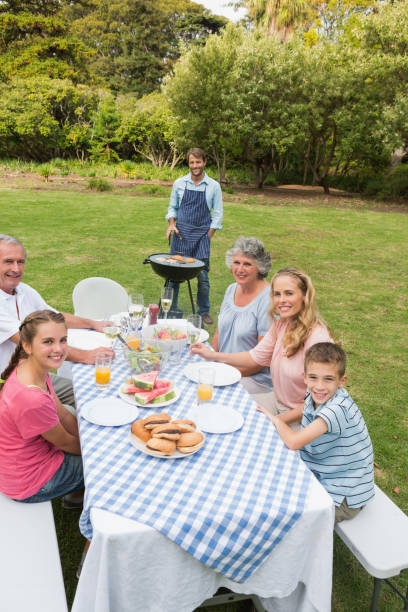 istock Cheerful extended family having a barbecue 835821248