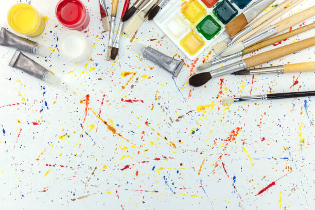 istock watercolor paints and paintbrushes palette on colorful blobs background 835821844