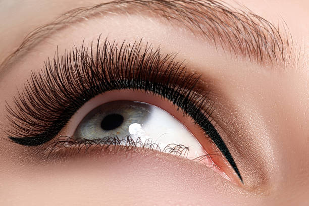 istock Macro shot of woman's beautiful eye with extremely long eyelashes 835824422