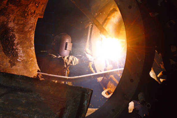 istock Welder at work in an industrial building 835824804