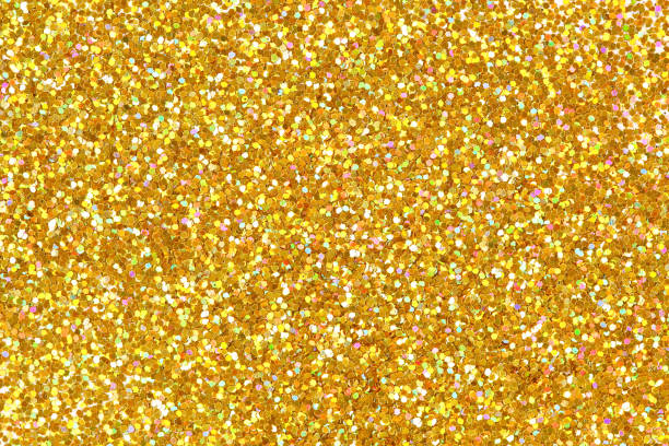 Detailed texture of glittering golden dust surface