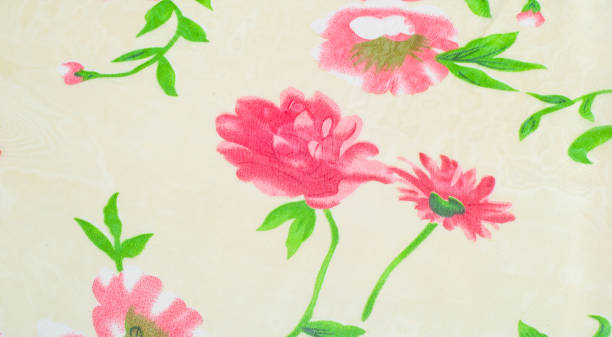istock texture of silk fabric. background. Beige with red flowers 835829214