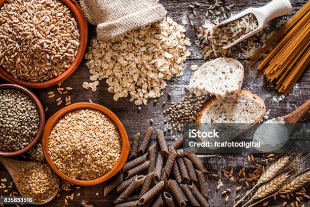 Wholegrain Food Still Life Shot On Rustic Wooden Table Stock Photo - Download Image Now