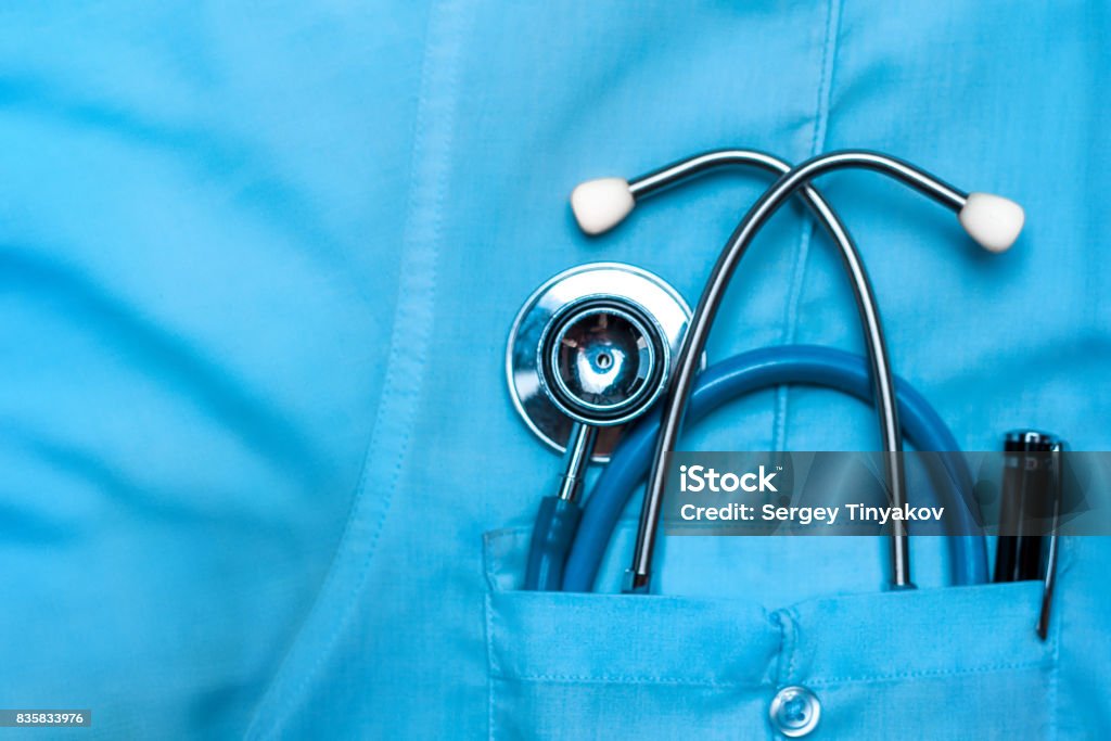Global Healthcare Medicine Insurance Doctor Concept Stethoscope and pen in doctor robe pocket. Concept Of The Global Healthcare, Medicine And Insurance Healthcare And Medicine Stock Photo