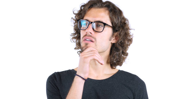 istock Young man  with Curly Hairs thinking over business matters 835837786