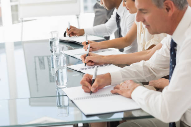 istock Business people taking notes at a meeting 835841252