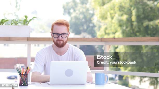 Upset Man After Failure Of Project Loss Sitting In Outdoor Office Red Hairs Stock Photo - Download Image Now