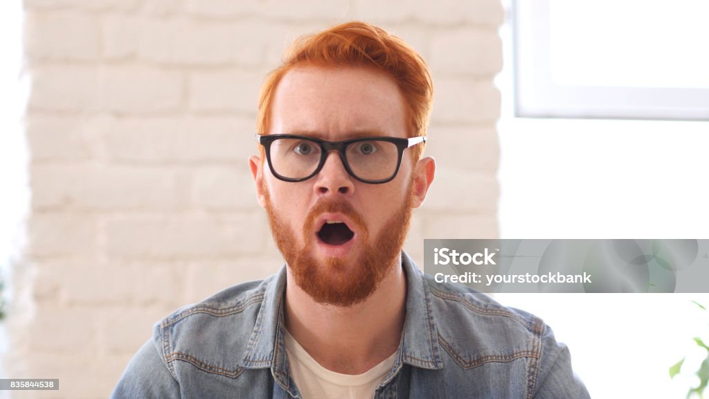 Shocked nad Confused Unsatisfied Man with Beard and Red Hairs, Open Mouth Acting - Performance Stock Photo