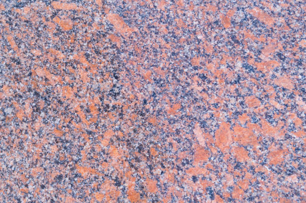 istock Pattern of red colorful granite, closeup. Background, textured. 835849372