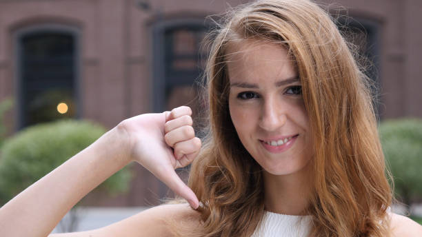 istock Thumb Down by Beautiful young Girl, Outdoor 835849818