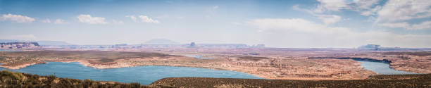 istock Panorama: american landscape with a desert, canyons and a lake 835856040