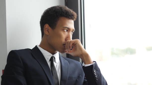 istock Thinking Pensive Afro-American Businessman in Suit, Looking Through Window 835857832