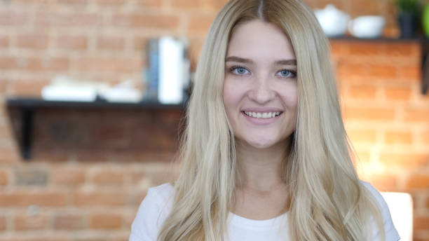 istock Smiling Young Blond Girl Looking in Camera 835865574