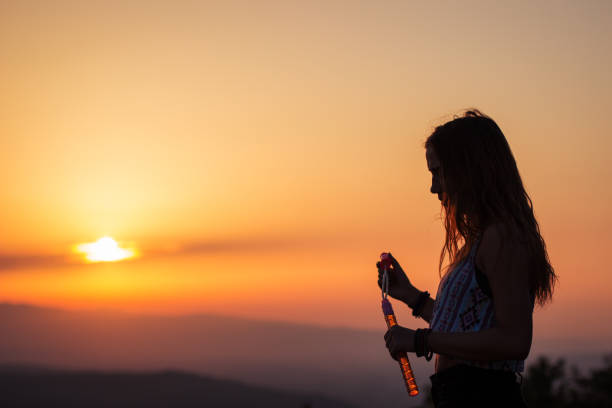 istock Young beautiful girl blowing bubbles 835872404